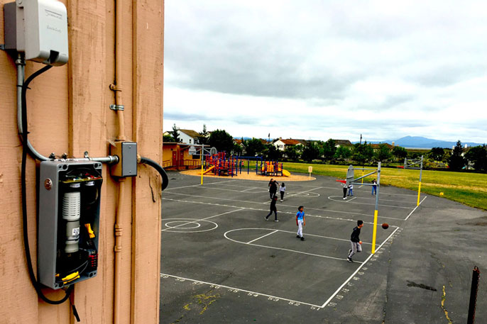 BEACON sensor near a playground basketball court