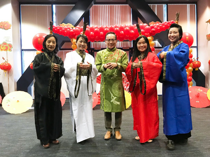 UC Irvine faculty wear traditional clothing at a Lunar New Year celebration
