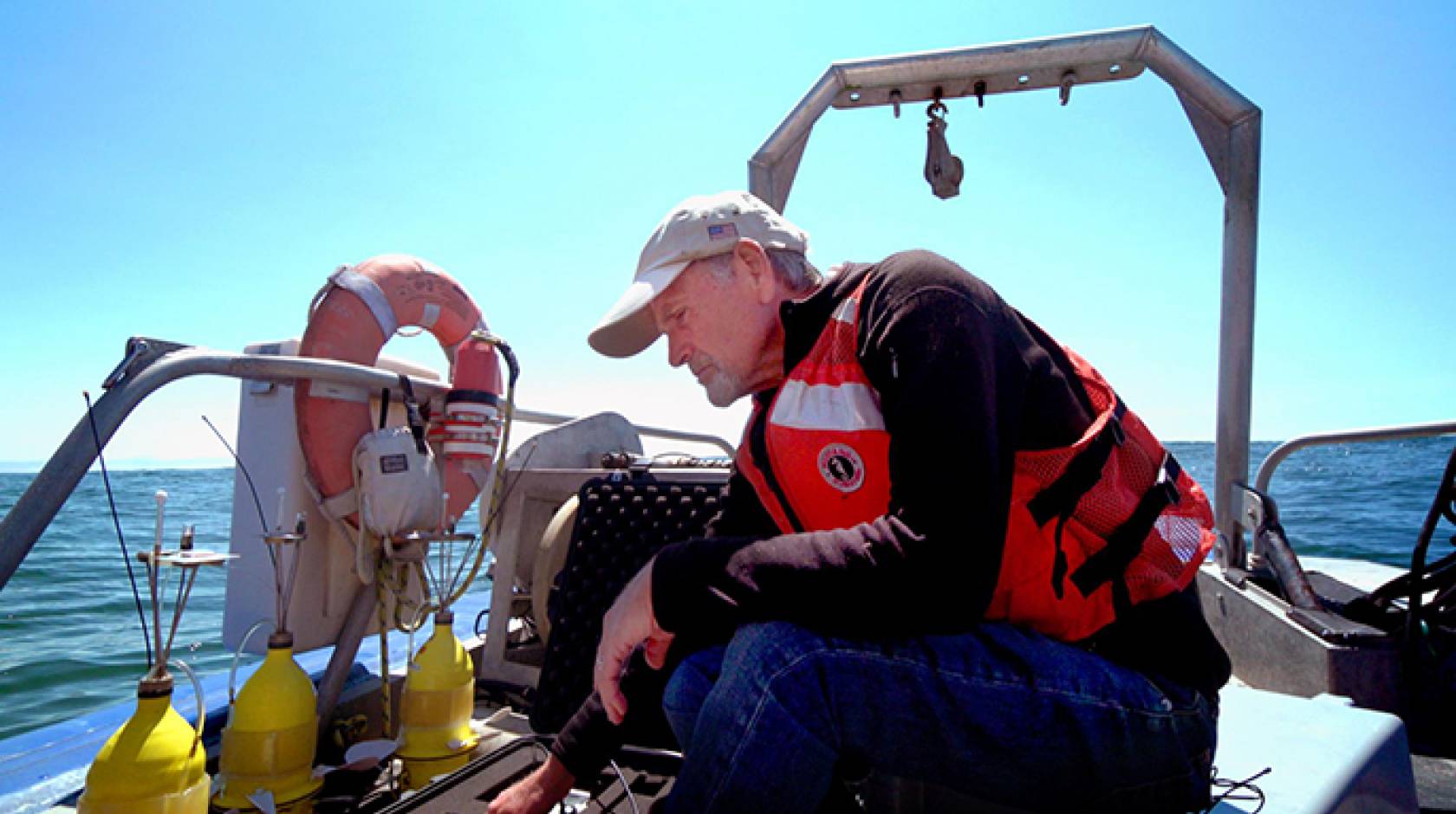UC Davis professor and marine ecologist Steven Morgan prepares to deploy yellow "robot larvae" off the coast of Bodega Bay.