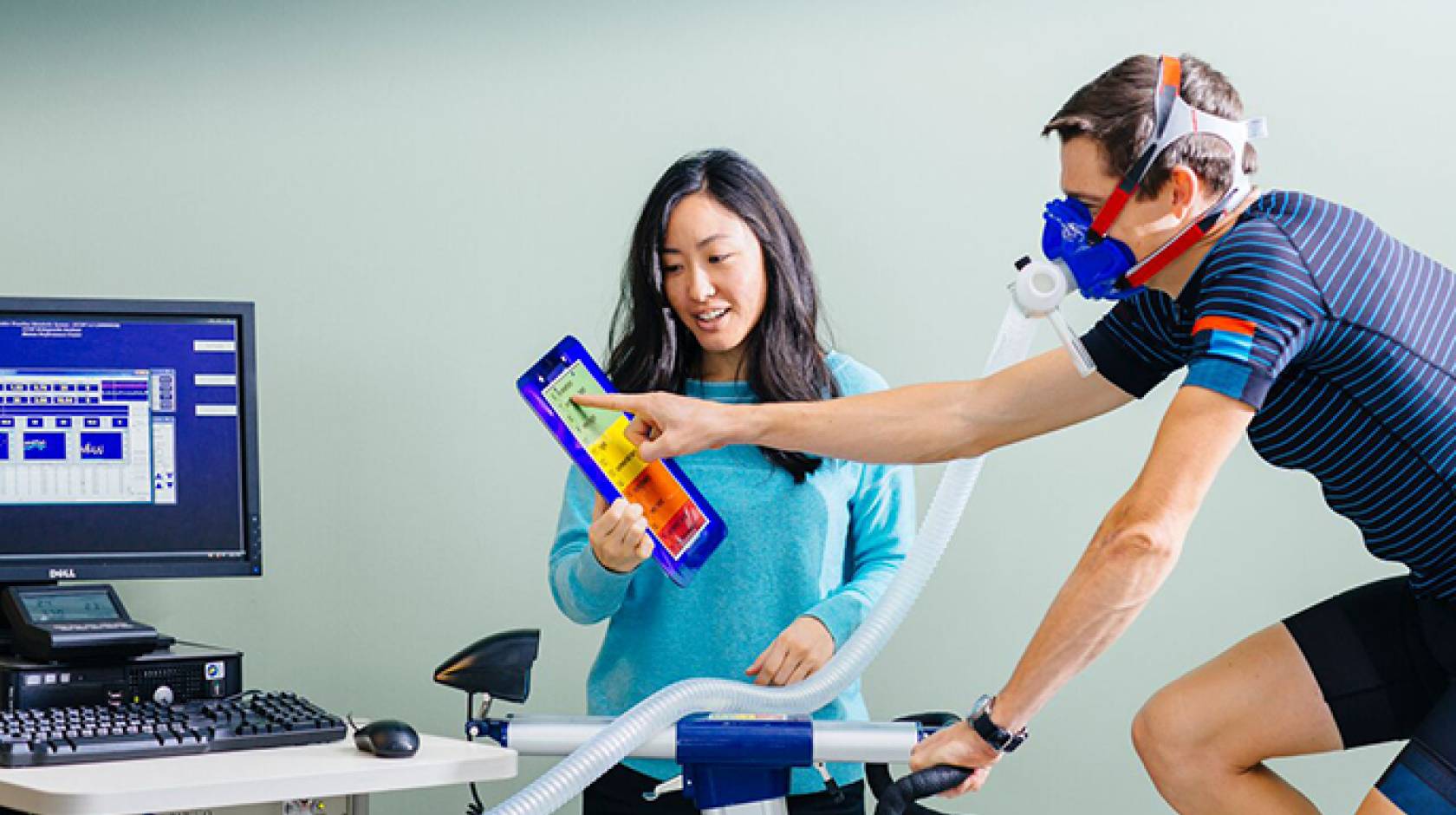 UC San Francisco research fellow Cheri Mah, shown here with cyclist Kurt Wolfgang, studies sleep and performance in elite athletes, and consults with professional sports teams to improve their athletes’ sleep habits.