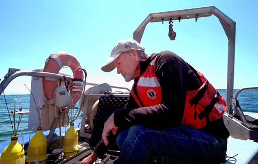 UC Davis professor and marine ecologist Steven Morgan prepares to deploy yellow "robot larvae" off the coast of Bodega Bay.