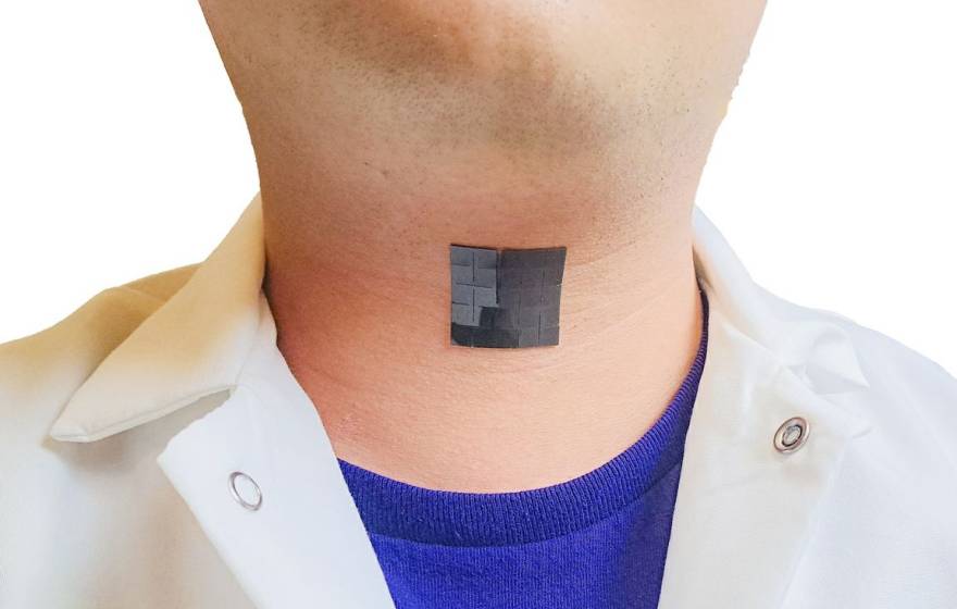A black patch in the middle of a person's neck