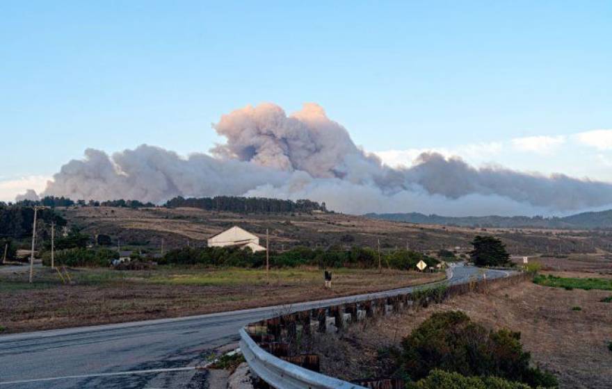 Cloud from a wildfire over a hill near Santa Cruz