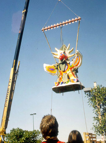 Sun god being lowered by a crane old photo