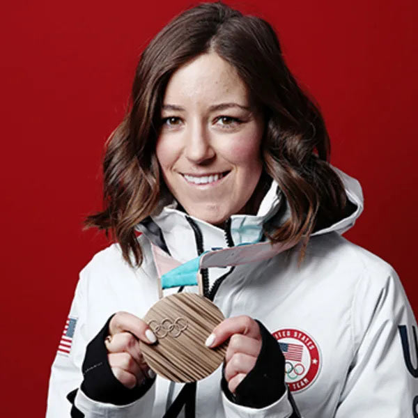 Brita Sigourney holds her bronze medal