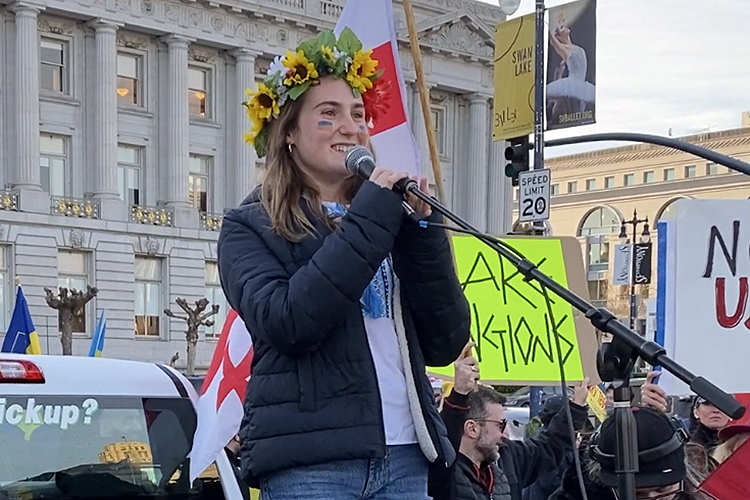 Marina Mezhibovsky speaking at a large pro-Ukraine rally in front of San Francisco City Hall