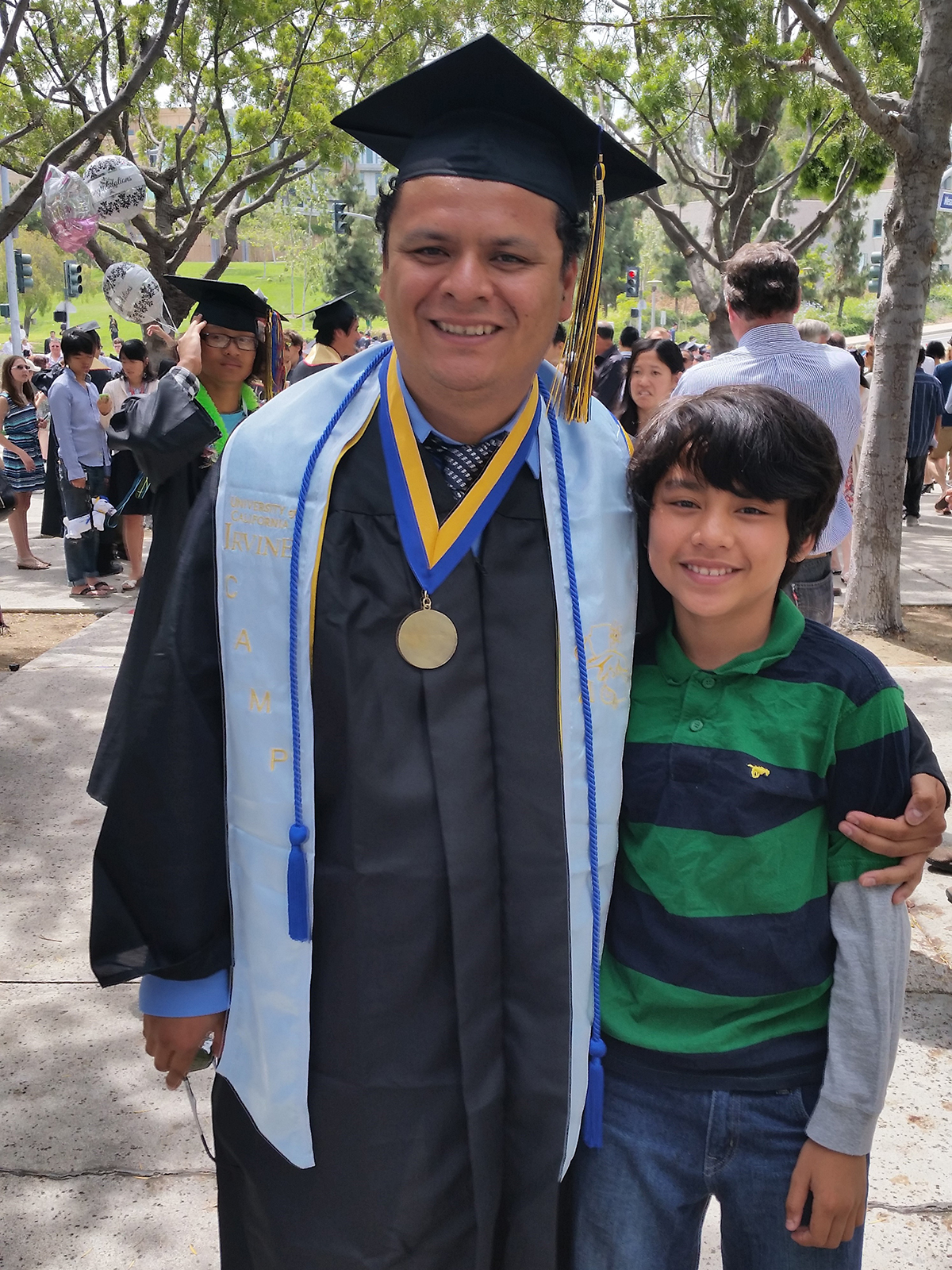 Edwin Solares with son at UC Irvine graduation
