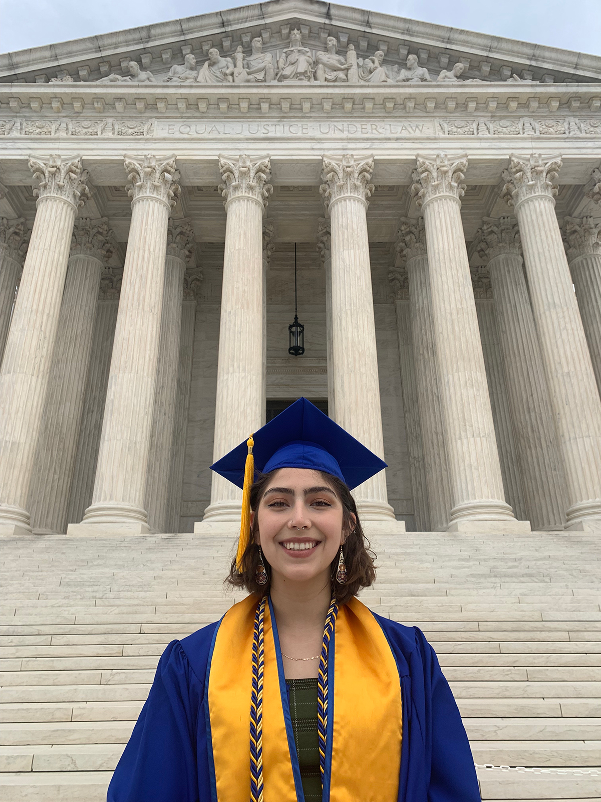 Liliana Lara Hazel in graduation stole and robe