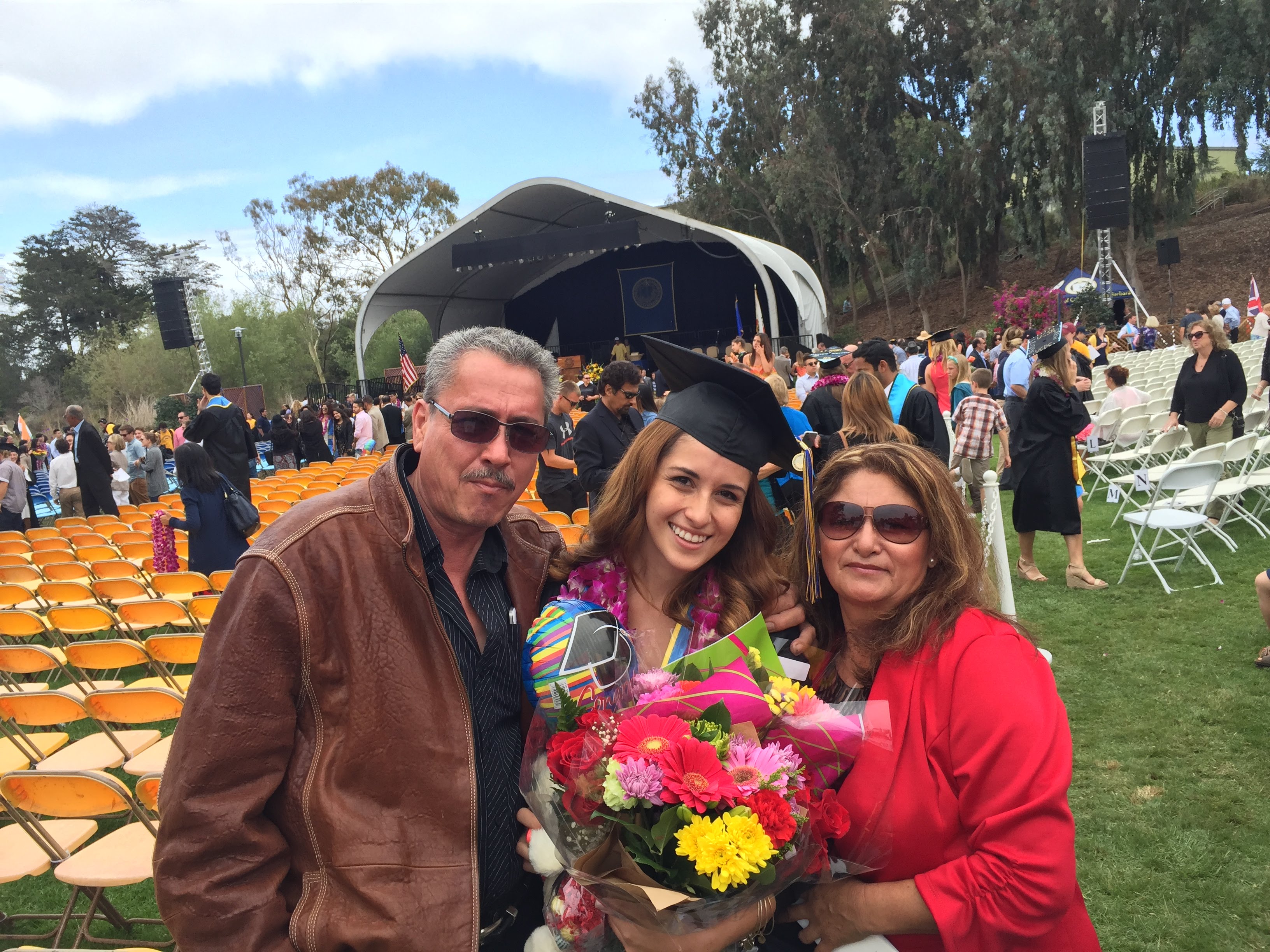 Rosa Mora celebrates with her parents at graduation from UC Santa Barbara