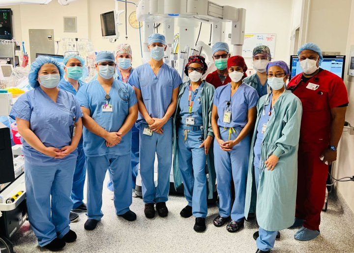 Surgical team posing together for a photo