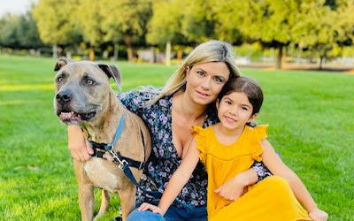 Tyson the dog with dog mom and human child