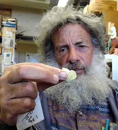Art Shapiro holding a cabbage white butterfly