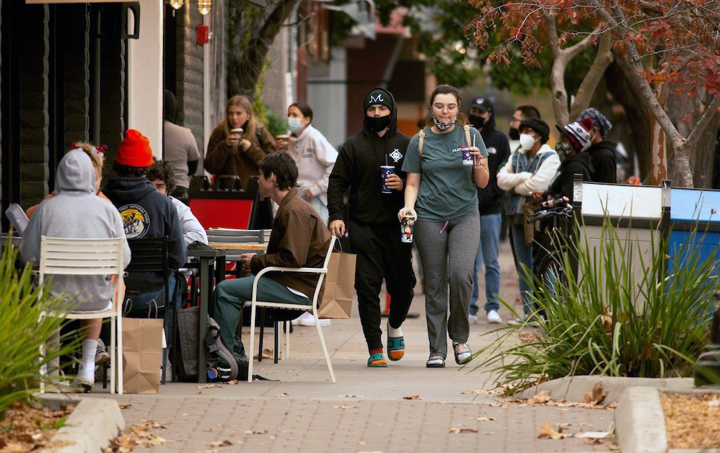 People walking through downtown Davis