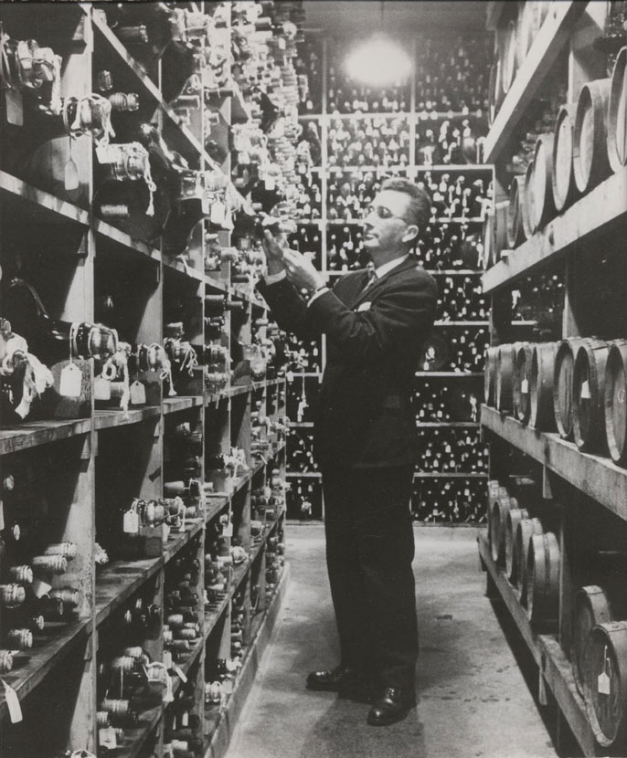 Man in a wine cellar at UC Davis, black and white photo