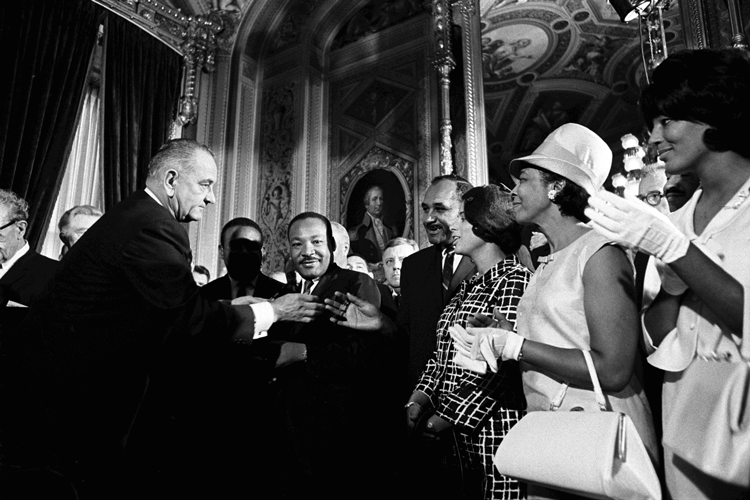President Lyndon B. Johnson (left) meeting with the Rev. Martin Luther King (center) and other civil rights leaders after Johnson signed the Voting Rights Act of 1965