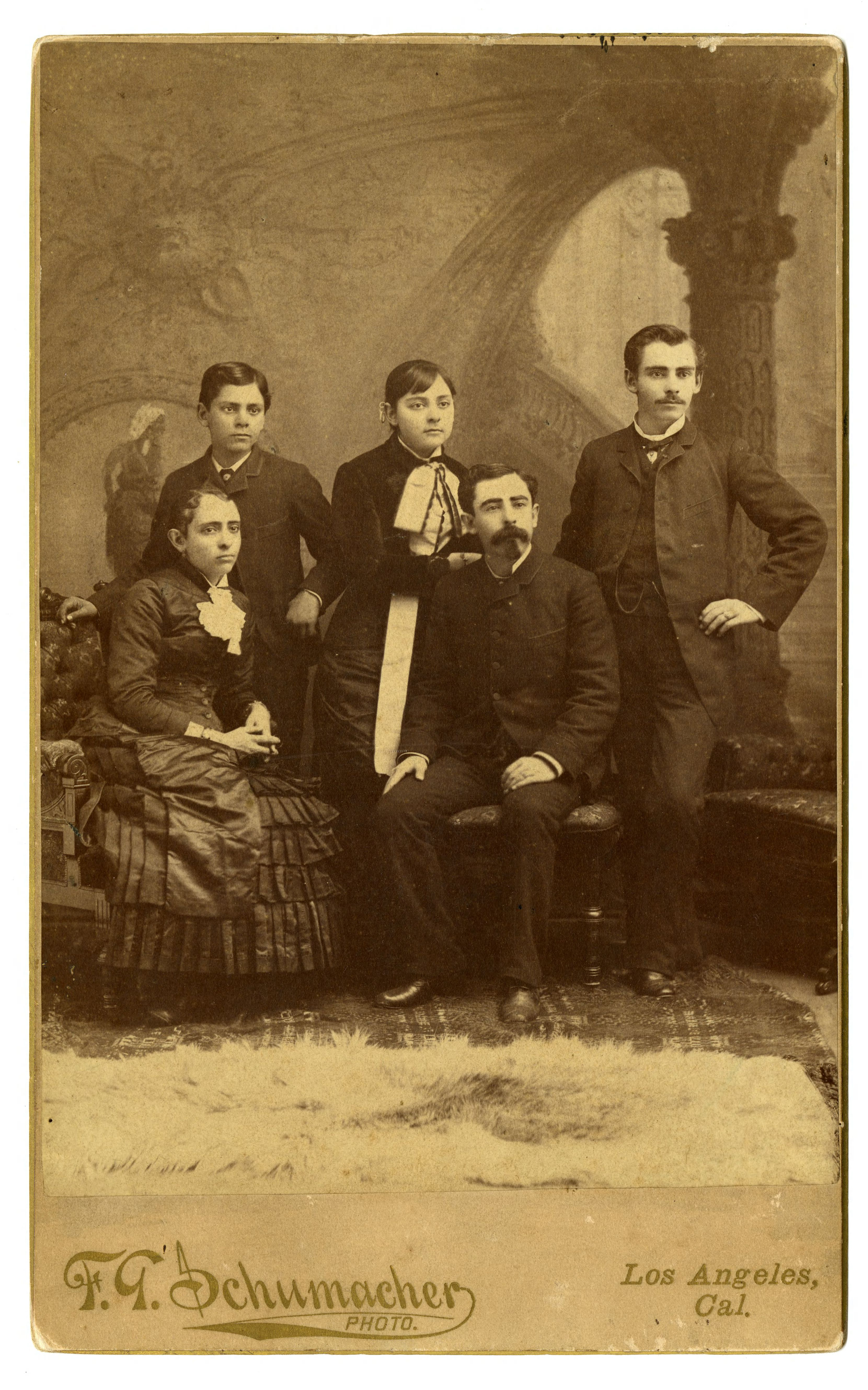 19th-century formal portrait of five siblings