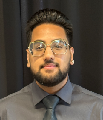 Young man with glasses and a beard in a shirt and tie