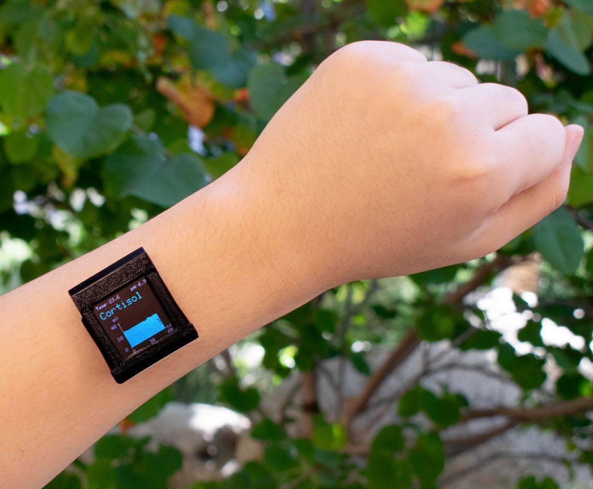 closeup of a person's arm wearing a sensor on the wrist