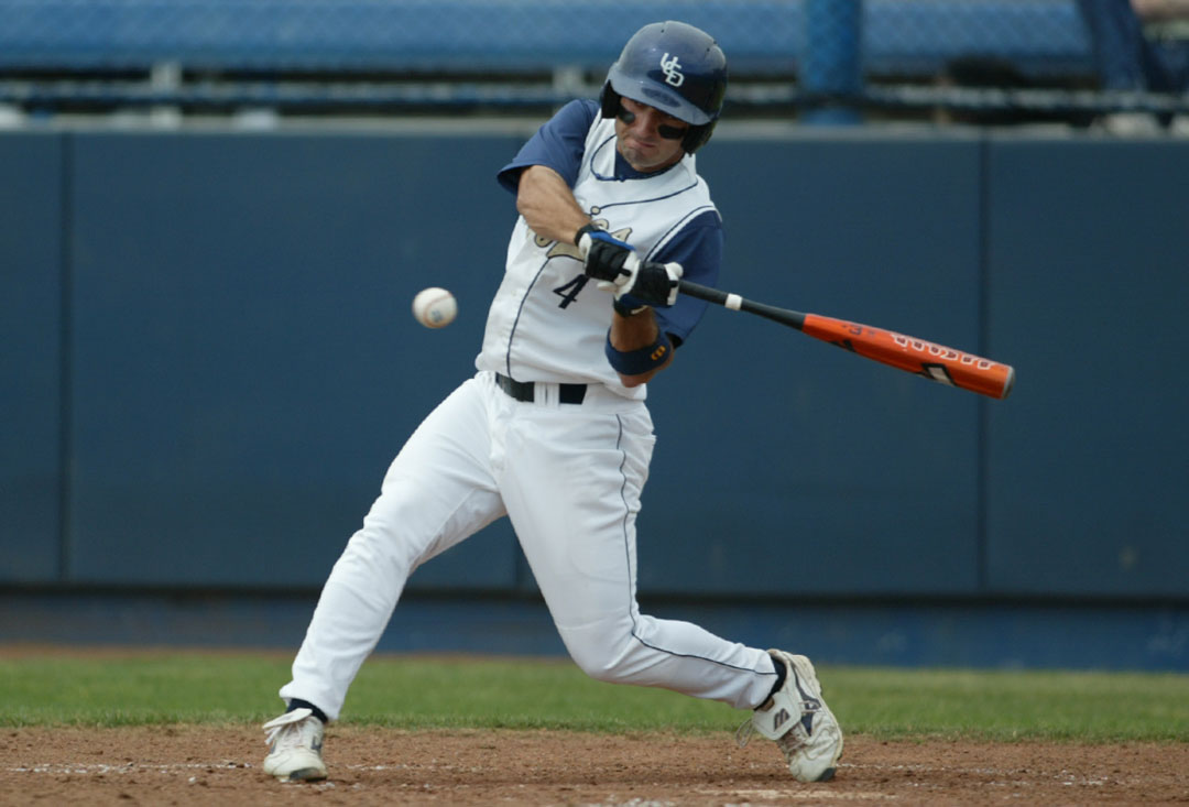 Daniel Descalo in the process of swinging at a pitch