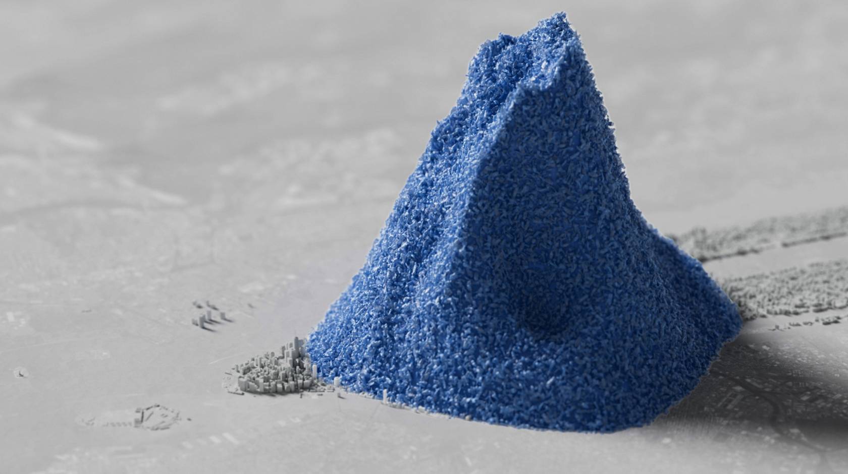 3D-looking illustration of a pile of blue plastic beads dwarfing a scale model of Manhattan