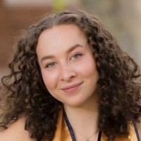 Allie Larman smiles at the camera in a closely cropped image