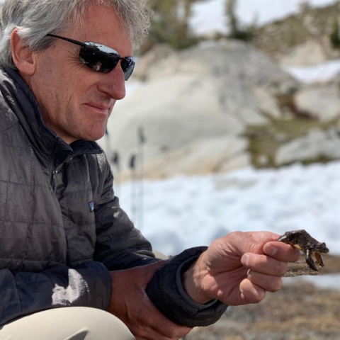 Roland Knapp holding a frog