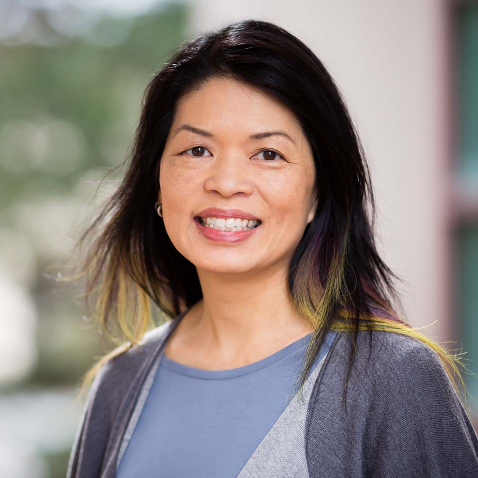 Woman smiling at camera in casual wear