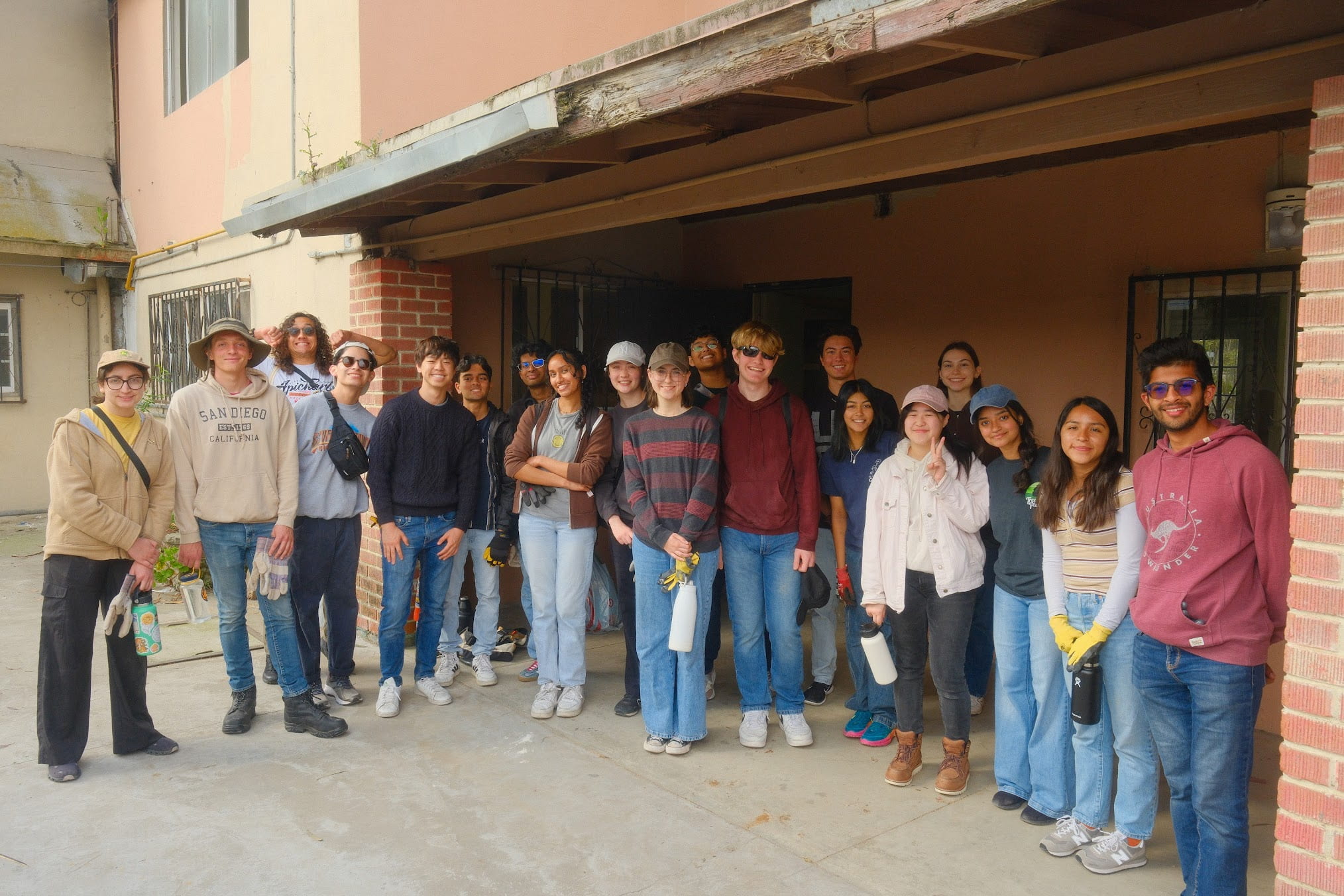 A group of people standing in front of a building