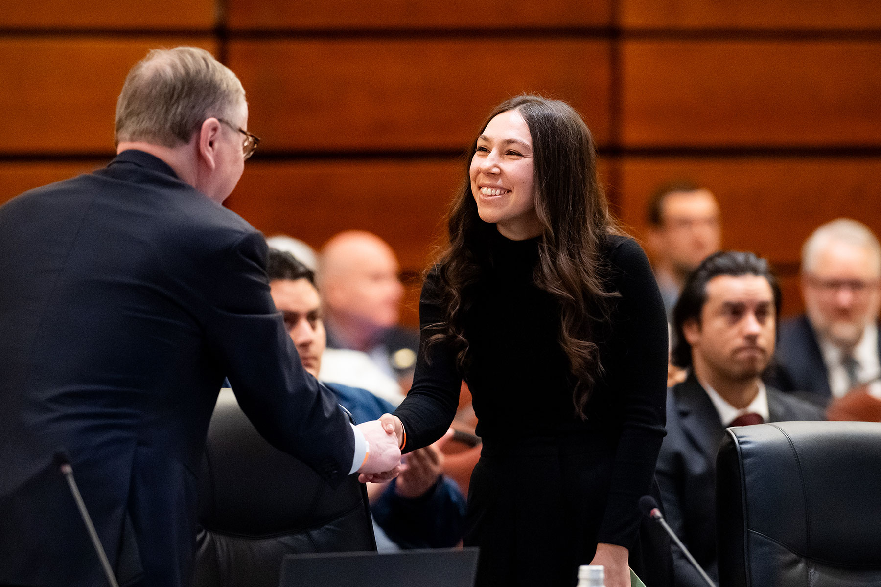 UC San Francisco fourth-year medical student Alli Gomez-Ojeda shakes hands with Chancellor Sam Hawgood