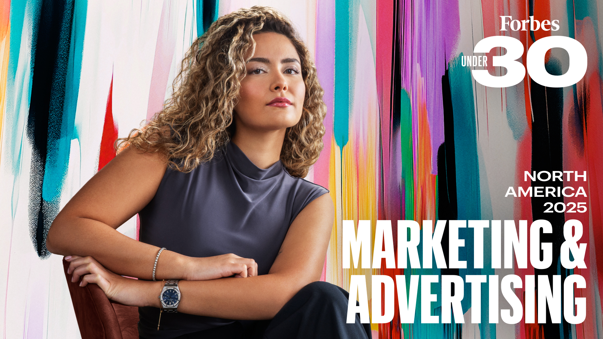 Young woman with curly hair against a colorful background with Forbes 30 Under 30 Marketing & Advertising branding