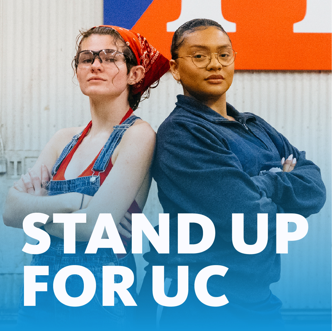 Two students standing back to back with the words "Stand up for UC"