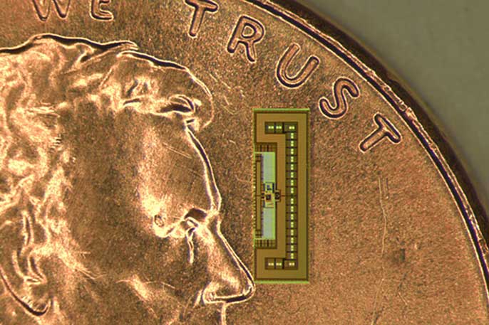 ant-sized radio (atop coin for comparison)