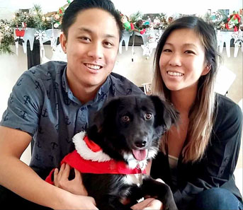 Tina Wang and her husband with their dog