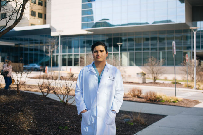 DACA medical student in front of hospital