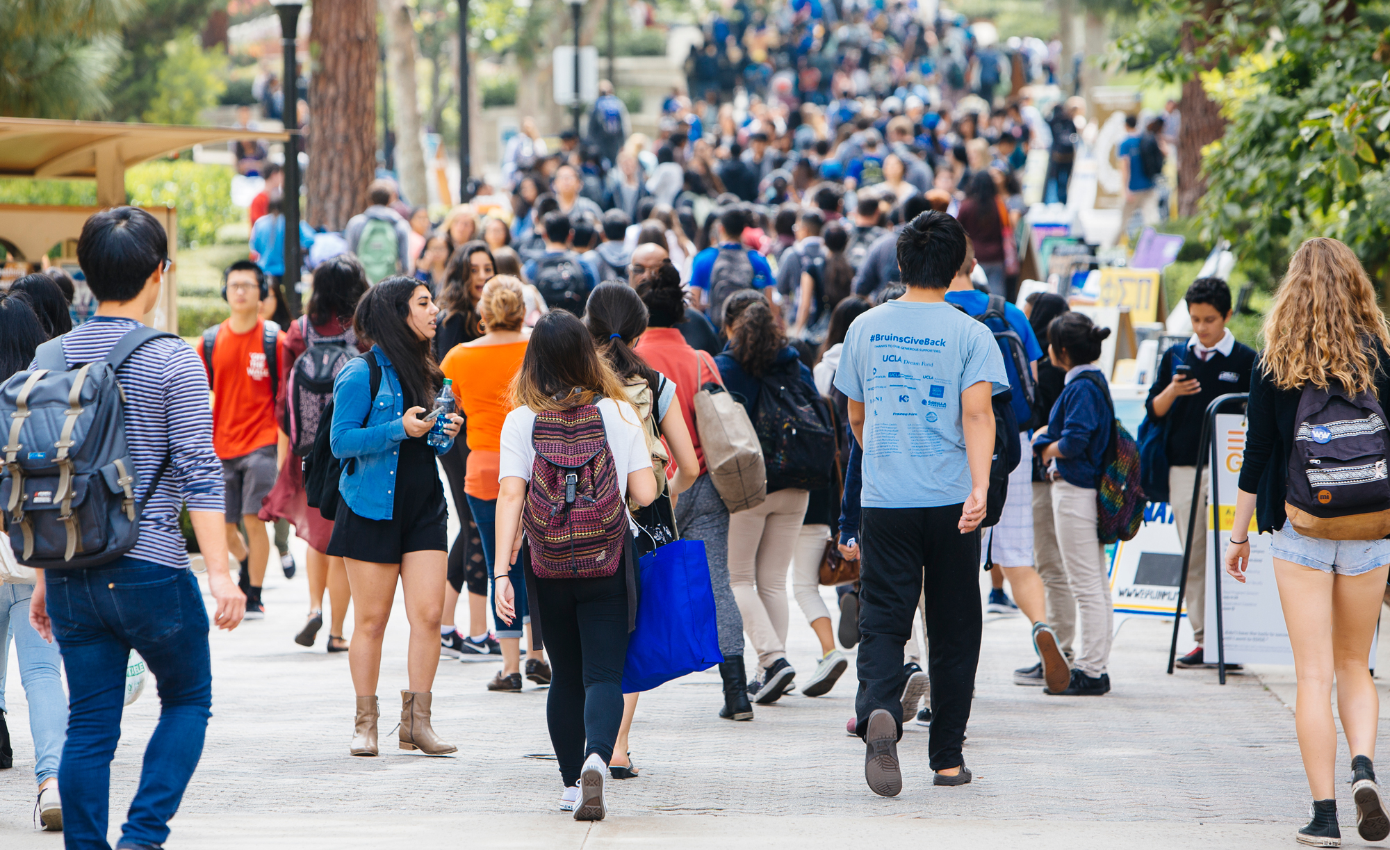 A UC campus outdoor walkway filled with students