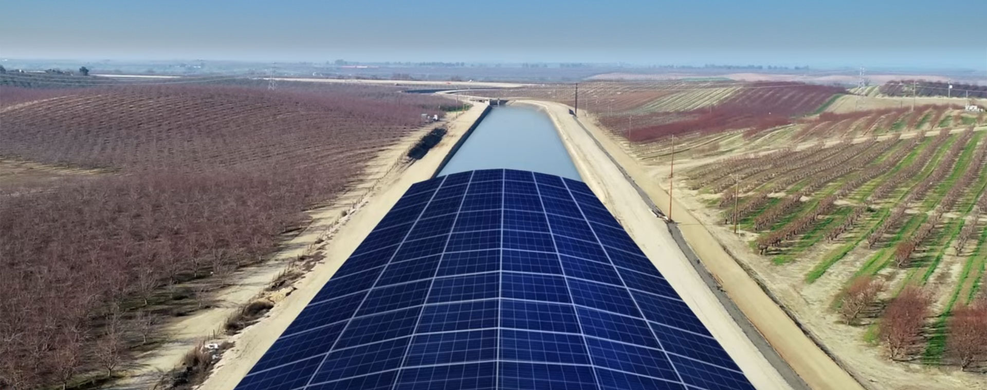 A rendering of solar panels covering an agricultural canal