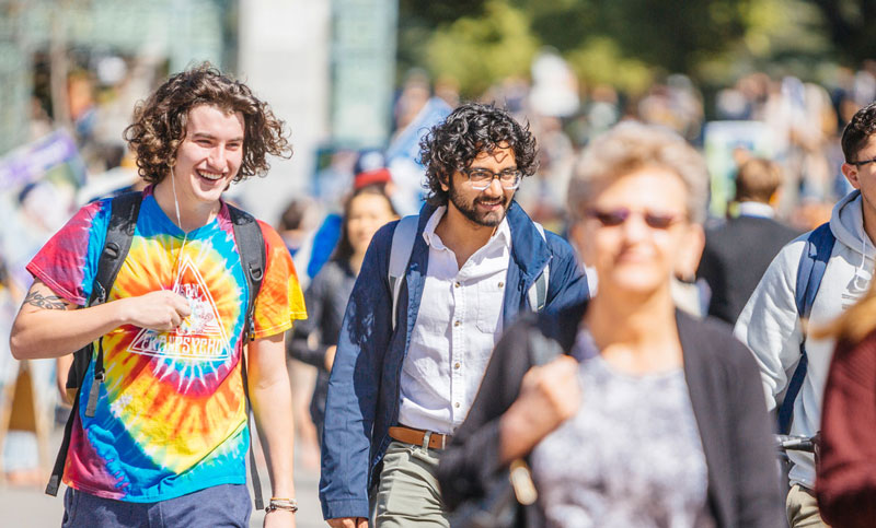 Happy students walking on campus