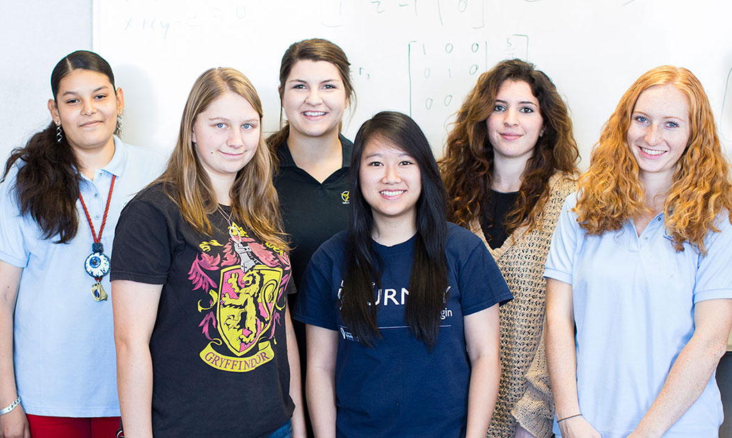 Female STEM students standing together