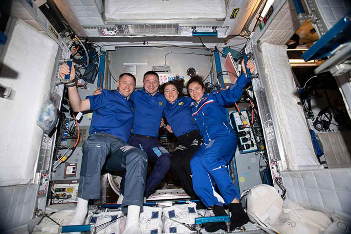 Meir and other astronauts on the space station