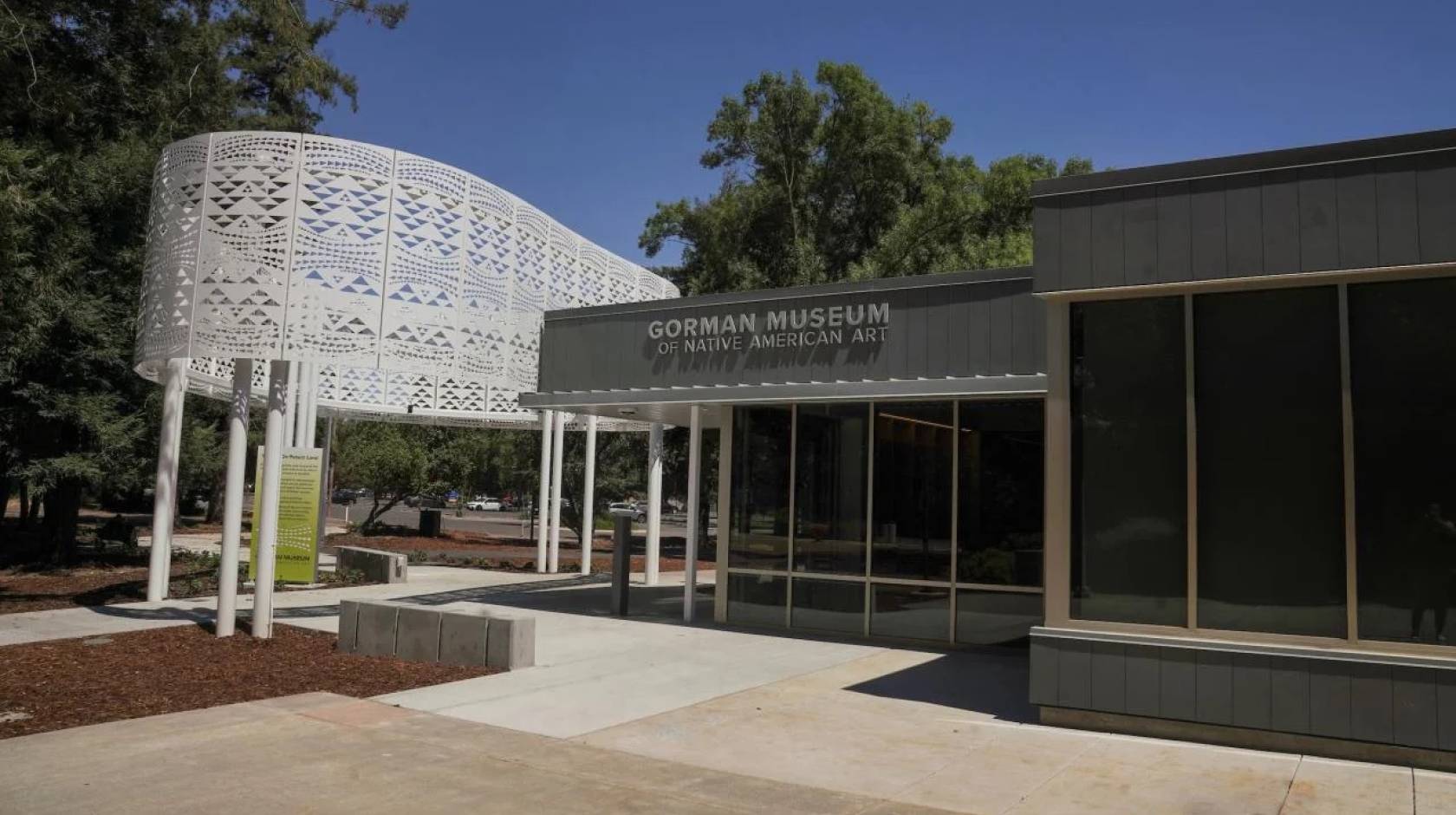 Entrance to the Gorman Museum, a white steel structure and one-story glass and concrete front