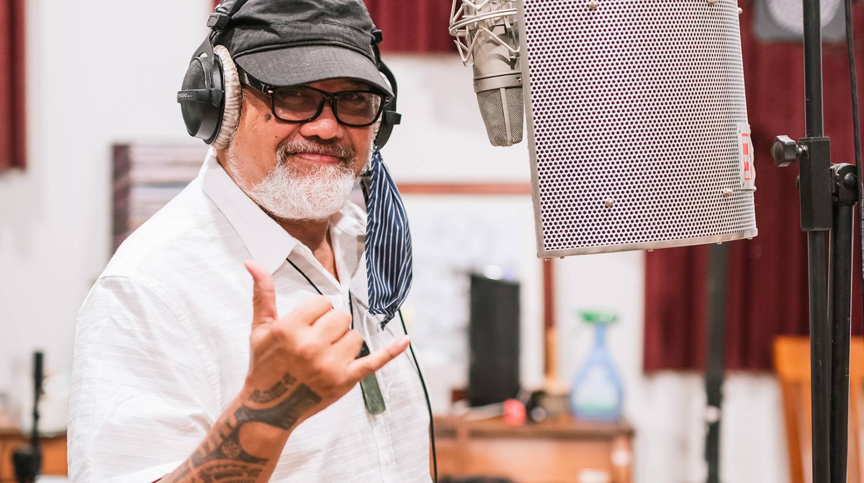 Bruddah Waltah flashes a shaka in a recording studio