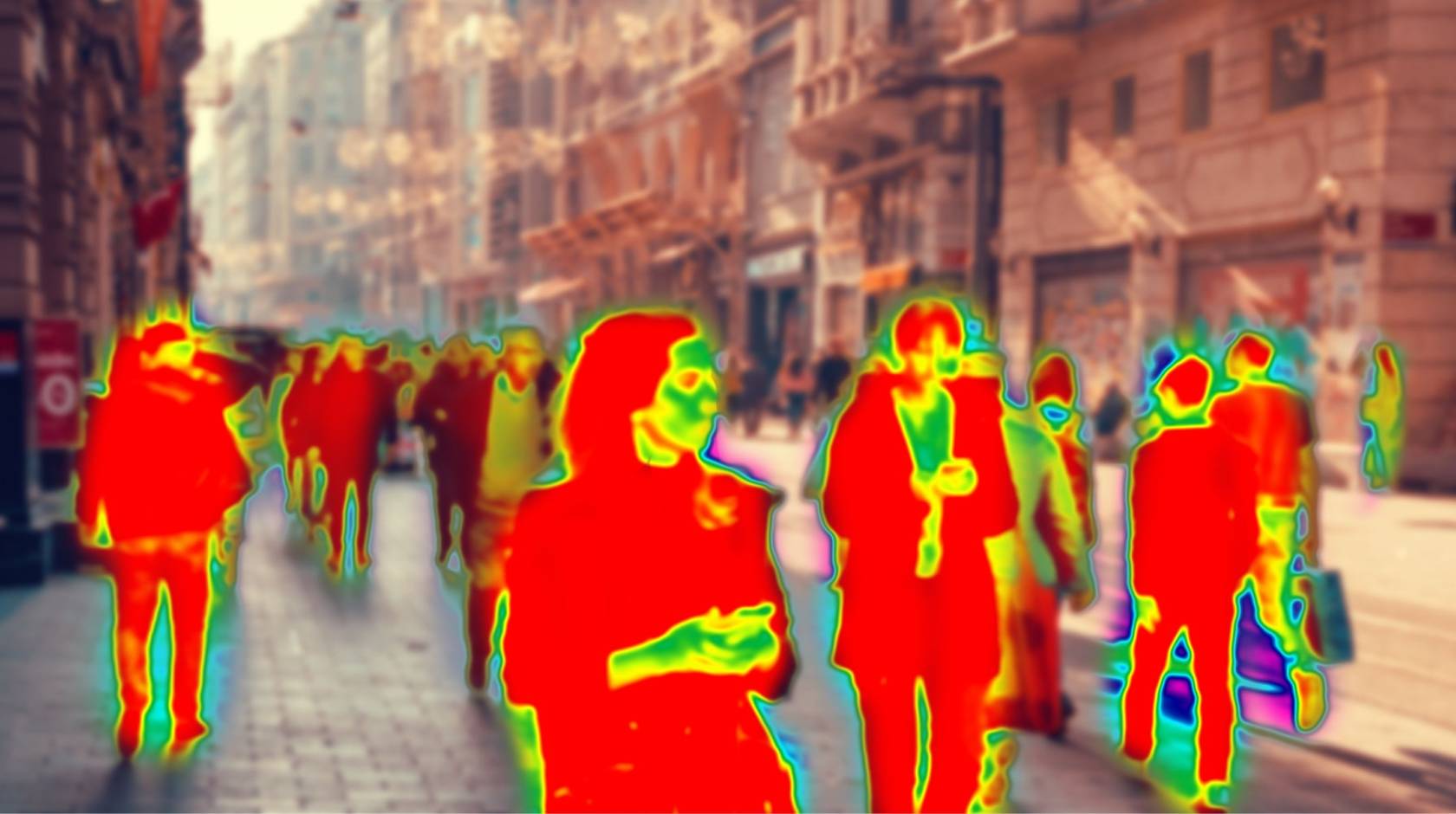 Pedestrians walking down a street, where the human figures are abstracted into red, yellow and green colors like a heat map