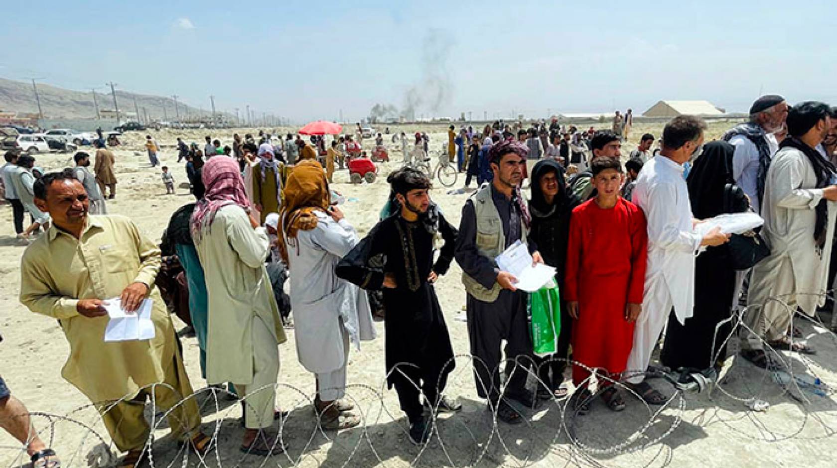 People gathered outside the airport in Kabul