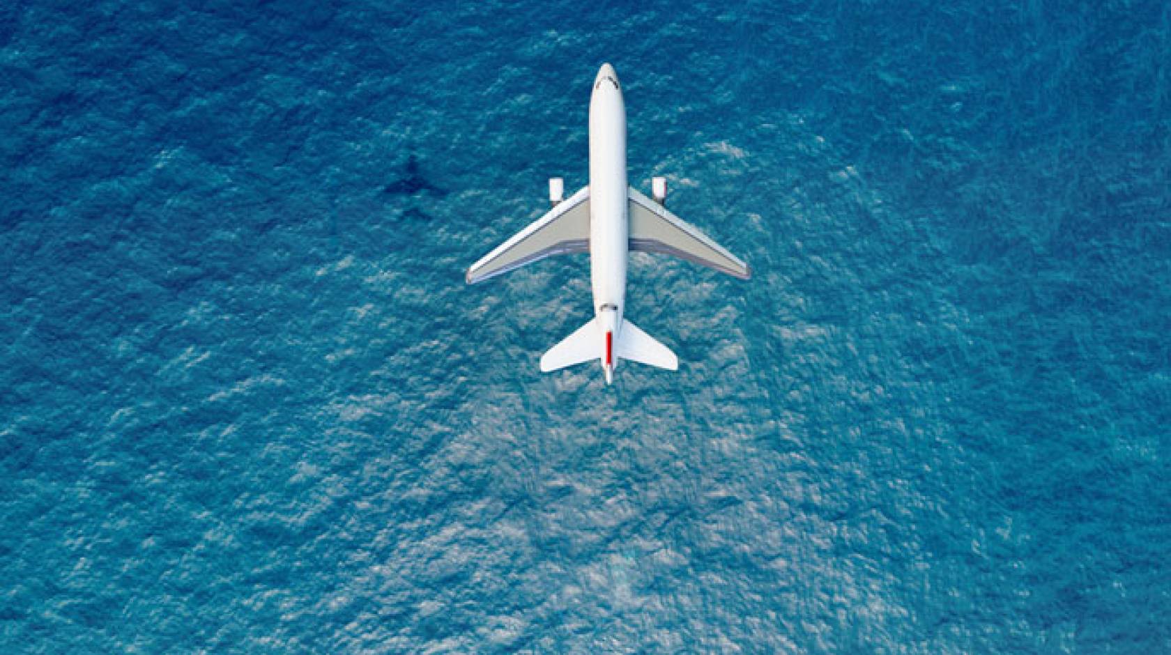 Airplane flying over the sea