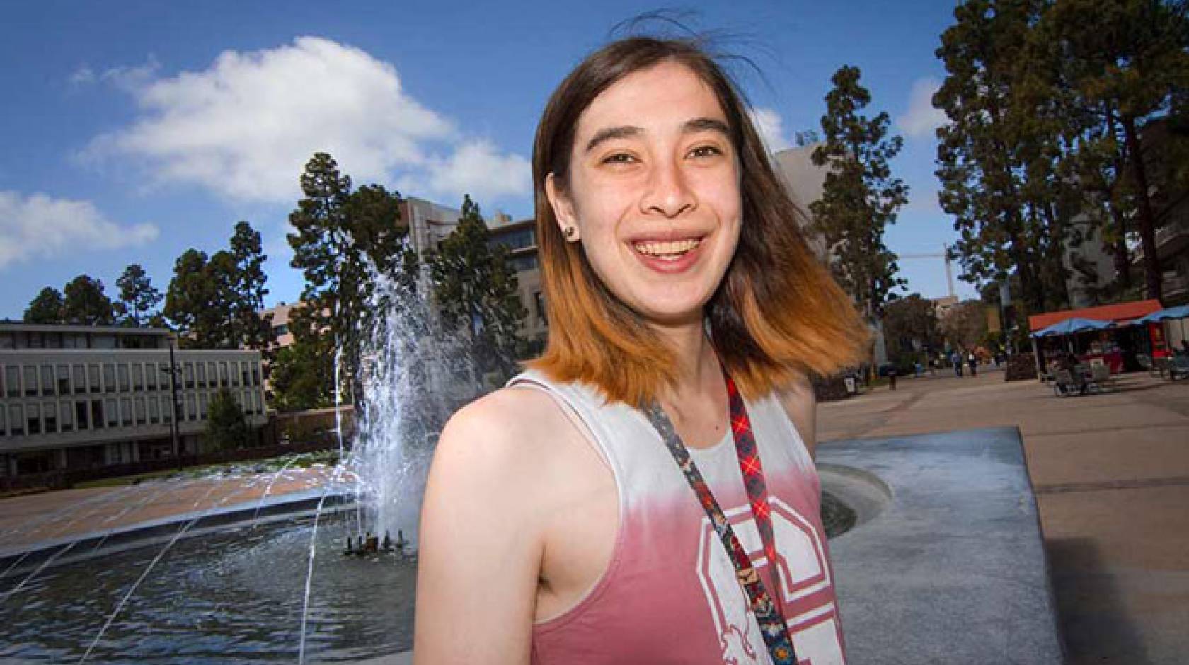 Amber in front of a fountain