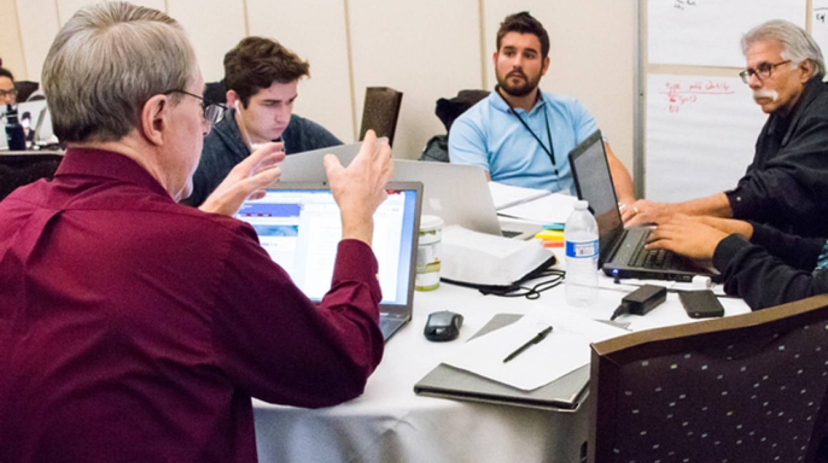 Winning team, Ag for Hire, brainstorms its app at the Apps for Ag Hackathon with the UC Davis World Food Center.