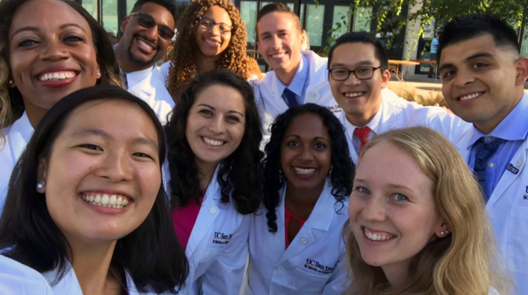 Group selfie of doctors in white coats