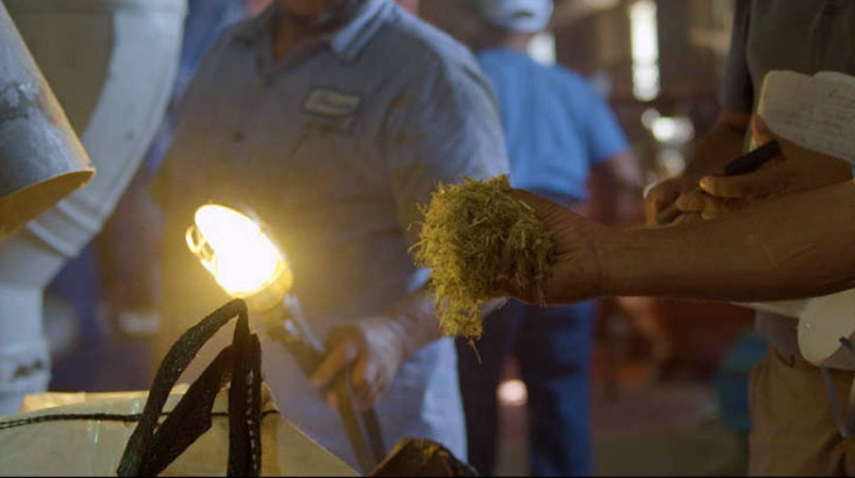 A close-up photo of a demonstration of how biochar is made