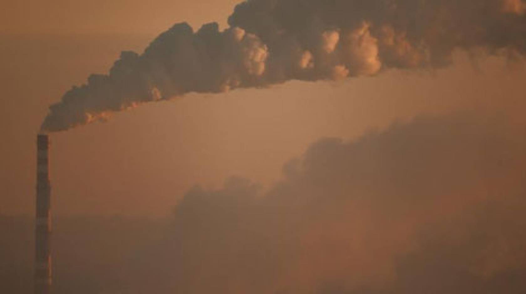 A smokestack plant emitting CO2