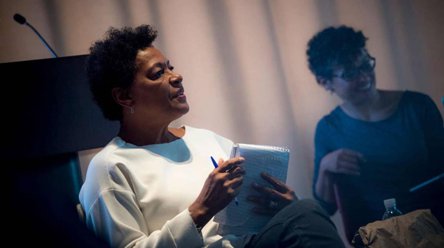 Carrie Mae Weems holds a notepad